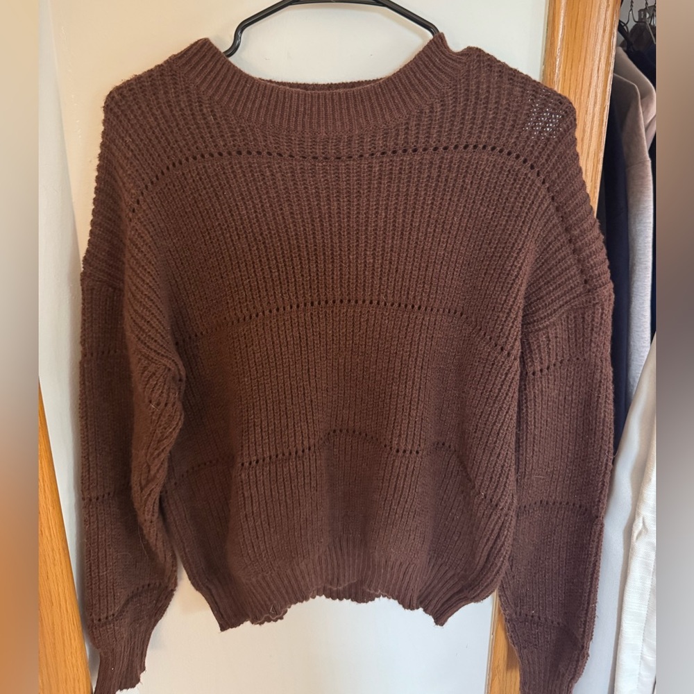 Brown sweater.